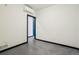 Empty bedroom with concrete floors and a closet at 1601 Park Ave # 106, Denver, CO 80218