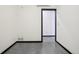 Empty bedroom with concrete floors and closet door at 1601 Park Ave # 106, Denver, CO 80218