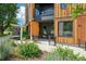 Stylish condo entrance with wood paneling and a welcoming front porch at 1601 Park Ave # 106, Denver, CO 80218