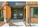 Close-up of condo entrance with a charming front porch and modern design at 1601 Park Ave # 106, Denver, CO 80218