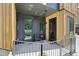 Inviting front porch with dual entryways, modern lighting, and stylish accents on a sunny day at 1601 Park Ave # 106, Denver, CO 80218
