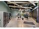 Lobby with mailboxes, modern hanging chairs, stylish lighting and sleek concrete flooring at 1601 Park Ave # 106, Denver, CO 80218