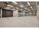 Spacious parking garage featuring a modern car elevator system for convenient and secure vehicle storage at 1601 Park Ave # 106, Denver, CO 80218