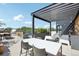 Spacious roof deck offers dining and lounge seating, a grilling station, and city views at 1601 Park Ave # 106, Denver, CO 80218