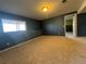 Spacious basement with plush carpeting, natural light, and neutral paint, ready for flexible use at 1517 Stanley Dr, Erie, CO 80516