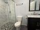 Updated bathroom featuring a glass shower and stylish vanity at 1517 Stanley Dr, Erie, CO 80516
