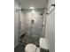 Large bathroom with a walk-in shower and modern fixtures at 1517 Stanley Dr, Erie, CO 80516