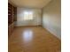Versatile room with hardwood floors and a large window, perfect for a home office or guest room at 1517 Stanley Dr, Erie, CO 80516
