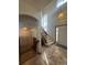 Inviting entryway features tile flooring, a staircase with wood railing, and a large window offering plenty of natural light at 1517 Stanley Dr, Erie, CO 80516