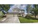Two-story house with attached garage and landscaped yard at 1517 Stanley Dr, Erie, CO 80516