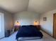 Cozy bedroom with carpet and accent lighting on either side of the bed at 1517 Stanley Dr, Erie, CO 80516