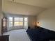 Bright main bedroom featuring bay window, neutral carpet, and ample closet space at 1517 Stanley Dr, Erie, CO 80516