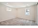 Comfortable bedroom with soft carpet, natural light and neutral paint, ideal for relaxation and personalization at 2065 Depew St, Edgewater, CO 80214