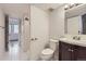 Bathroom featuring tile flooring, single sink vanity, toilet, and shower at 1830 Newland Ct # 209, Lakewood, CO 80214