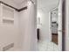 Shower with white subway tile and built-in niche, adjacent to a vanity at 1830 Newland Ct # 209, Lakewood, CO 80214