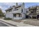 Charming condo exterior with a balcony and well maintained landscaping and stairs to other condos at 1830 Newland Ct # 209, Lakewood, CO 80214