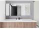 Bathroom vanity features a white marble countertop, wood cabinets, and a large mirror at 545 Strada Rossa Rd, Golden, CO 80401