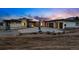 Stunning modern home featuring a stone facade and three-car garage with a spacious driveway at 545 Strada Rossa Rd, Golden, CO 80401