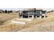 Contemporary home with multiple balconies on a lot with terraced landscaping at 545 Strada Rossa Rd, Golden, CO 80401