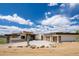 Striking modern home featuring a spacious driveway leading to a multi-car garage with stylish wood-tone doors at 545 Strada Rossa Rd, Golden, CO 80401