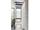Hallway with clerestory windows offering bright light and mountain views at 545 Strada Rossa Rd, Golden, CO 80401