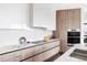 A modern, spacious kitchen with stainless steel appliances, stone countertops and custom cabinets at 545 Strada Rossa Rd, Golden, CO 80401