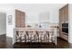 Modern kitchen island with seating complemented by sleek white and wood cabinets and counter tops at 545 Strada Rossa Rd, Golden, CO 80401