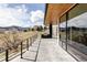 Spacious patio offering scenic views, an outdoor grilling area, and modern railing design at 545 Strada Rossa Rd, Golden, CO 80401