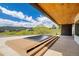 Relaxing outdoor patio with a built-in plunge pool, wooden deck, and expansive views of the surrounding landscape at 545 Strada Rossa Rd, Golden, CO 80401