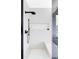 Contemporary shower with rainfall shower head, built-in bench, and mountain view at 545 Strada Rossa Rd, Golden, CO 80401