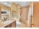 Well-maintained bathroom with granite countertop, tile shower, and neutral color scheme at 12348 Elizabeth Ct, Thornton, CO 80241