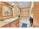 Bathroom featuring granite counters, decorative tiles, and a shower-tub combination at 12348 Elizabeth Ct, Thornton, CO 80241