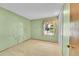 Serene bedroom with a tree decal, neutral carpet, and a bright window view at 12348 Elizabeth Ct, Thornton, CO 80241