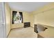 Sunny bedroom with neutral carpet, ample storage, and a built-in desk area at 12348 Elizabeth Ct, Thornton, CO 80241