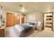 Comfortable bedroom with a large closet, soft carpet, and relaxing light to create a calming atmosphere at 12348 Elizabeth Ct, Thornton, CO 80241