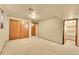 Spacious bedroom with ample storage in the large closet and access to a walk-in closet at 12348 Elizabeth Ct, Thornton, CO 80241