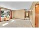 Large living room with hardwood floors and a big window at 12348 Elizabeth Ct, Thornton, CO 80241