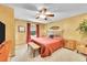 Cozy main bedroom with a ceiling fan, stylish decor, and neutral carpet at 12348 Elizabeth Ct, Thornton, CO 80241