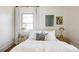 Bright bedroom with a cozy bed and soft bedding at 1431 S Emerson St, Denver, CO 80210