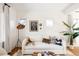 White living room with hardwood floors and a cozy sofa at 1431 S Emerson St, Denver, CO 80210