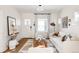 Light-filled living room, hardwood floors, and comfy seating at 1431 S Emerson St, Denver, CO 80210