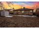 Backyard with patio, shed, and grassy area at 2042 Jamaica St, Aurora, CO 80010