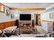 Finished basement recreation room, TV, and access to other rooms at 2042 Jamaica St, Aurora, CO 80010