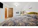 Bright bedroom featuring a large window, ample sunlight, and stylish decor for comfortable living at 2042 Jamaica St, Aurora, CO 80010