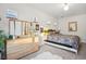 Spacious bedroom with a large bed and plenty of natural light at 2042 Jamaica St, Aurora, CO 80010