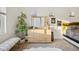 Bedroom featuring a dresser, mirror, and large window at 2042 Jamaica St, Aurora, CO 80010