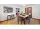 Dining room features a wooden table and access to the backyard at 2042 Jamaica St, Aurora, CO 80010