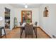 Bright dining room with wood table and access to backyard at 2042 Jamaica St, Aurora, CO 80010