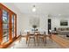 Charming dining room with a modern table, seating for six, and natural light at 2042 Jamaica St, Aurora, CO 80010