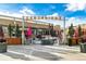 Outdoor seating area at Eastbridge with planters and shade structures, creating a vibrant gathering spot at 2042 Jamaica St, Aurora, CO 80010